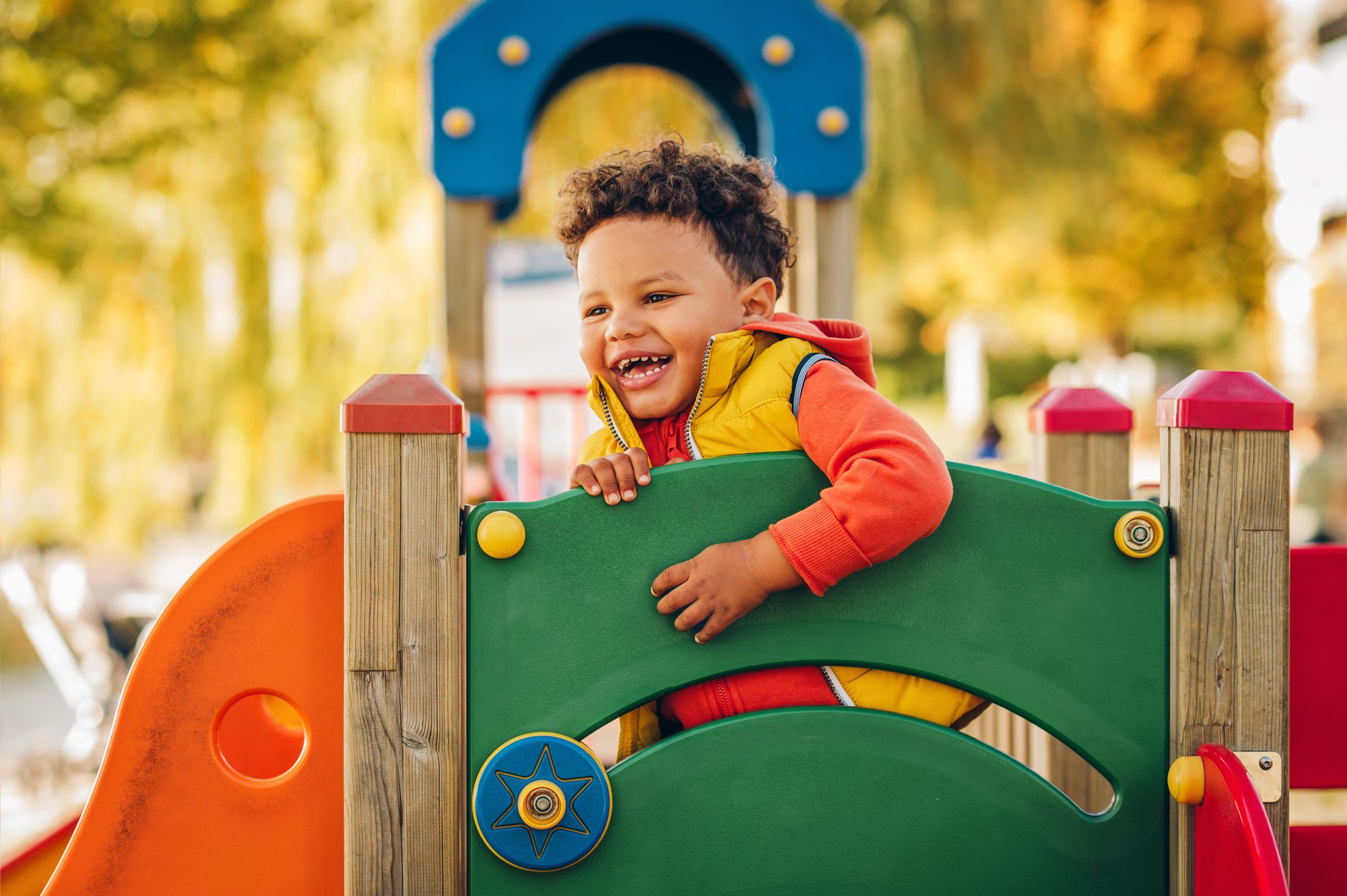 Child playing on a playground illustrating that Underfence is kid-safe